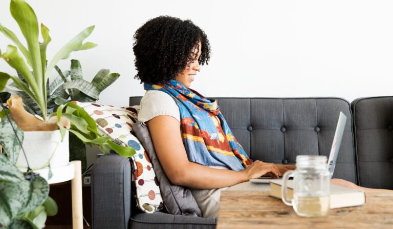 Woman works on computer at home