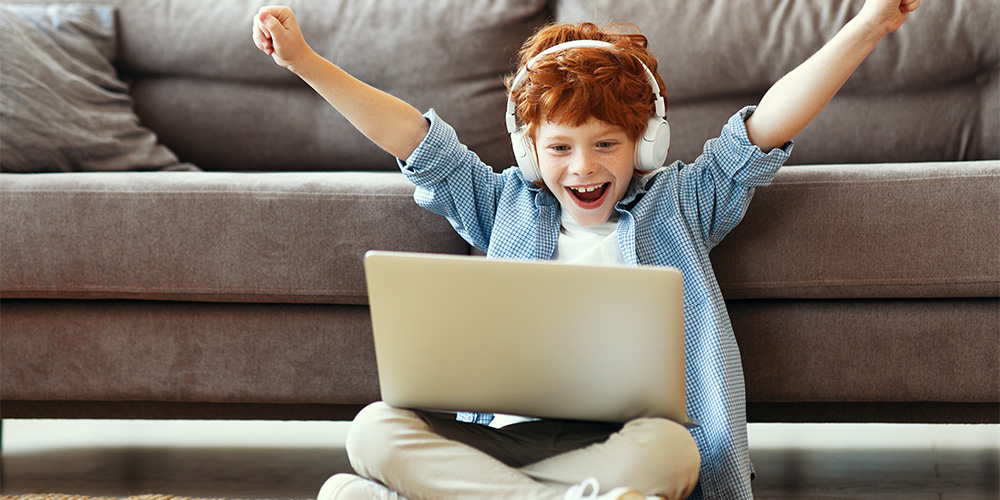 Child playing with computer