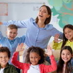 teacher smiling with students in classroom